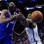 
              Philadelphia 76ers' James Harden, left, tries to get a shot past Brooklyn Nets' Kyrie Irving during the first half of an NBA basketball game, Thursday, March 10, 2022, in Philadelphia. (AP Photo/Matt Slocum)
            
