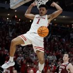 
              Wisconsin's Johnny Davis dunks during the second half of a first-round NCAA college basketball tournament game against Colgate Friday, March 18, 2022, in Milwaukee. (AP Photo/Morry Gash)
            