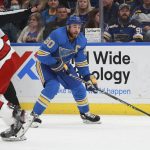 
              St. Louis Blues center Ryan O'Reilly (90) works the puck during the second period of an NHL hockey game against the Carolina Hurricanes, Saturday, March 26, 2022, in St. Louis. (AP Photo/Michael Thomas)
            