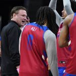
              Kansas head coach Bill Self, second from left, talks with players during a practice for the NCAA men's college basketball tournament Thursday, March 24, 2022, in Chicago. Kansas faces Providence in a Sweet 16 games on Friday. (AP Photo/Nam Y. Huh)
            