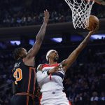 
              Washington Wizards' Kentavious Caldwell-Pope (1) goes to the basket against New York Knicks' Julius Randle (30) during the first quarter of an NBA basketball game Friday, March 18, 2022, in New York. (AP Photo/Jason DeCrow)
            