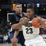 
              Purdue's Jaden Ivey (23) is fouled by Penn State's Myles Dread during the second half of an NCAA college basketball game at the Big Ten Conference tournament, Friday, March 11, 2022, in Indianapolis. (AP Photo/Darron Cummings)
            