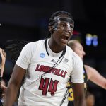 
              Louisville forward Olivia Cochran (44) reacts to a play against Michigan during the first half of a college basketball game in the Elite 8 round of the NCAA women's tournament Monday, March 28, 2022, in Wichita, Kan. (AP Photo/Jeff Roberson)
            