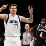 
              Dallas Mavericks guard Luka Doncic (77) signals to his bench in the first half of an NBA basketball game against the Brooklyn Nets, Wednesday, March 16, 2022, in New York. (AP Photo/John Minchillo)
            