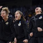 
              Michigan players react on the bench against Louisville during the first half of a college basketball game in the Elite 8 round of the NCAA women's tournament Monday, March 28, 2022, in Wichita, Kan. (AP Photo/Jeff Roberson)
            