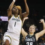
              Baylor forward NaLyssa Smith (1) shoots against Hawaii forward Amy Atwell (25) during the first half of a college basketball game in the first round of the NCAA tournament in Waco, Texas, Friday, March 18, 2022. (AP Photo/LM Otero)
            