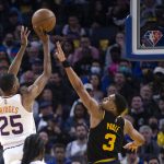 
              Phoenix Suns forward Mikal Bridges (25) shoots over Golden State Warriors guard Jordan Poole (3) during the first quarter of an NBA basketball game Wednesday, March 30, 2022, in San Francisco. (AP Photo/D. Ross Cameron)
            