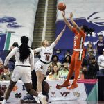 
              Miami forward Destiny Harden (3) takes the game-winning shot over Louisville guard Hailey Van Lith (10) at the end of an NCAA college basketball game in the quarterfinals of the Atlantic Coast Conference women's tournament in Greensboro, N.C., Friday, March 4, 2022. (AP Photo/Gerry Broome)
            