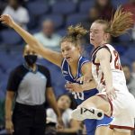 
              Creighton guard Morgan Maly, left, and Iowa State guard Lexi Donarski (21) chase the ball during the first half of a college basketball game in the Sweet 16 round of the NCAA women's tournament in Greensboro, N.C., Friday, March 25, 2022. (AP Photo/Gerry Broome)
            