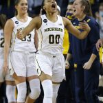 
              Michigan forward Naz Hillmon (00) celebrates during the finals second of the team's 62-51 win over Michigan State in an NCAA college basketball game Thursday, Feb. 24, 2022, in Ann Arbor, Mich. (AP Photo/Duane Burleson)
            