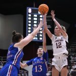 
              Stanford guard Lexie Hull (12) shoots over Kansas center Danai Papadopoulou (14) and guard Holly Kersgieter (13) during the second half of a second-round game in the NCAA women's college basketball tournament Sunday, March 20, 2022, in Stanford, Calif. (AP Photo/Tony Avelar)
            