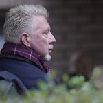 
              Former Wimbledon tennis champion Boris Becker looks back as he waits in a queue to get into Southwark Crown Court in London, Monday, March 21, 2022. Becker is in court accused of filing to hand over trophies from his glittering tennis career to settle debts, relating to charges over his bankruptcy. (AP Photo/Alastair Grant)
            