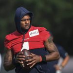 
              Texans quarterback Deshaun Watson (4) practices with the team during NFL football practice, Aug. 2, 2021, in Houston. Watson's complicated past didn't dissuade the Cleveland Browns from betting on the quarterback's future. He's on Cleveland's roster, and at this point that's the only certainty with the talented yet controversial QB. Watson's stunning trade to the Browns became official Sunday, March 20, 2022 capping a whirlwind few days during in which the three-time Pro Bowler — accused by 22 women of sexual harassment or assault — agreed to come to Cleveland after initially telling the team he wouldn't. (AP Photo/Justin Rex)
            