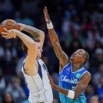 
              Charlotte Hornets guard Terry Rozier, right, defends against Dallas Mavericks guard Luka Doncic during the first half of an NBA basketball game Saturday, March 19, 2022, in Charlotte, N.C. (AP Photo/Rusty Jones)
            
