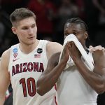 
              Arizona forward Azuolas Tubelis and guard Bennedict Mathurin leave the court after their loss to Houston in a college basketball game in the Sweet 16 round of the NCAA tournament on Thursday, March 24, 2022, in San Antonio. (AP Photo/Eric Gay)
            