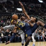 
              Indiana Pacers' Buddy Hield (24) is fouled by San Antonio Spurs' Devin Vassell during the first half of an NBA basketball game in San Antonio, Saturday, March 12, 2022. (AP Photo/Chuck Burton)
            