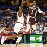 
              Mississippi State guard Iverson Molinar (1) shoots over South Carolina guard Jermaine Couisnard, left, during the first half of an NCAA men's college basketball game at the Southeastern Conference tournament in Tampa, Fla., Thursday, March 10, 2022. (AP Photo/Chris O'Meara)
            