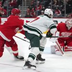
              Detroit Red Wings goaltender Alex Nedeljkovic (39) stops a Minnesota Wild center Nico Sturm (7) shot in the first period of an NHL hockey game Thursday, March 10, 2022, in Detroit. (AP Photo/Paul Sancya)
            