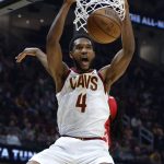 
              Cleveland Cavaliers' Evan Mobley (4) dunks against the Toronto Raptors during the first half of an NBA basketball game, Sunday, March 6, 2022, in Cleveland. (AP Photo/Ron Schwane)
            