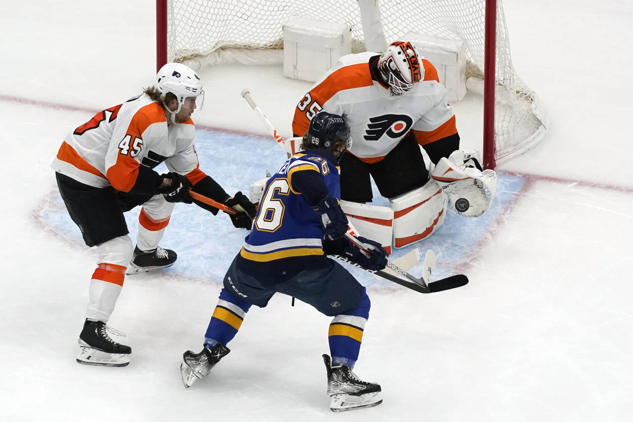St. Louis Blues' Nathan Walker (26) is unable to score past Philadelphia Flyers goaltender Martin J...