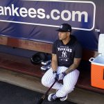 
              New York Yankees infielder Gleyber Torres waits in the dugout for batting practice to start during a spring training baseball workout, Monday, March 14, 2022, in Tampa, Fla. (AP Photo/John Raoux)
            