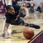 
              Louisville's Mason Faulkner (11) chases the ball as it goes out of bounds during the first half of the team's NCAA college basketball game against Virginia Tech on Tuesday, March 1, 2022, in Blacksburg, Va. (Matt Gentry/The Roanoke Times via AP)
            