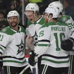 
              Dallas Stars left wing Riley Tufte (27) reacts in celebration with teammates after scoring a goal against Minnesota Wild goaltender Kaapo Kahkonen during the second period of an NHL hockey game, Sunday, March 6, 2022, in St. Paul, Minn. (AP Photo/Stacy Bengs)
            