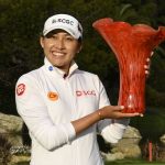 
              Atthaya Thitikul, of Thailand, holds up the trophy after winning the JTBC LPGA golf tournament, Sunday, March 27, 2022, in Carlsbad, Calif. (AP Photo/Denis Poroy)
            