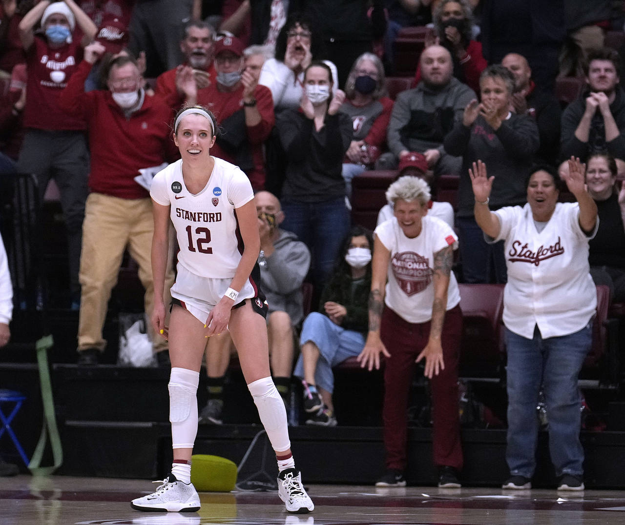 Stanford guard Lexie Hull (12) smiles as the crowd reacts to her 3-point basket against Kansas duri...