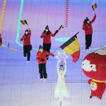 
              Remi Mazi carries the flag of Belgium during the opening ceremony at the 2022 Winter Paralympics, Friday, March 4, 2022, in Beijing. (AP Photo/Dita Alangkara)
            
