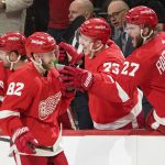 
              Detroit Red Wings defenseman Jordan Oesterle (82) celebrates his goal against the Minnesota Wild in the third period of an NHL hockey game Thursday, March 10, 2022, in Detroit. (AP Photo/Paul Sancya)
            