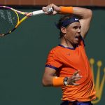 
              Rafael Nadal, of Spain, returns to Reilly Opelka at the BNP Paribas Open tennis tournament Wednesday, March 16, 2022, in Indian Wells, Calif. (AP Photo/Marcio Jose Sanchez)
            