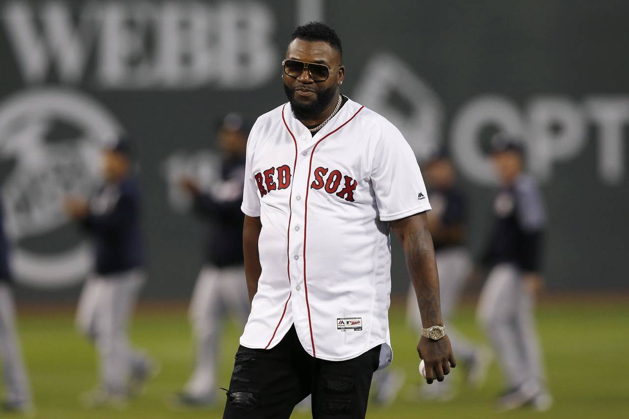 Former Boston Red Sox's David Ortiz prepares to throw out the ceremonial first pitch before a baseb...