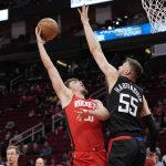 
              Los Angeles Clippers' Isaiah Hartenstein (55) reaches to block the shot of Houston Rockets' Alperen Sengun during the first half of an NBA basketball game Tuesday, March 1, 2022, in Houston. (AP Photo/David J. Phillip)
            
