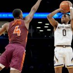 
              Notre Dame's Blake Wesley (0) shoots over Virginia Tech's Nahiem Alleyne (4) in the second half of an NCAA college basketball game during quarterfinals of the Atlantic Coast Conference men's tournament, Thursday, March 10, 2022, in New York. (AP Photo/John Minchillo)
            