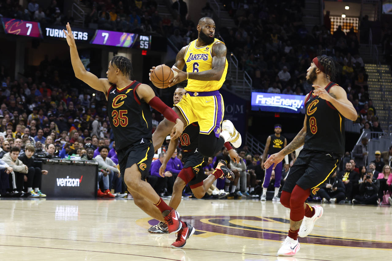 Los Angeles Lakers' LeBron James (6) passes the ball against Cleveland Cavaliers' Isaac Okoro (35) ...