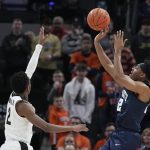 
              Penn State's Jalen Pickett (22) shoots over Purdue's Eric Hunter Jr. (2) during the second half of an NCAA college basketball game at the Big Ten Conference tournament, Friday, March 11, 2022, in Indianapolis. (AP Photo/Darron Cummings)
            