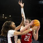 
              Utah forward Jenna Johnson (22) shoots against Stanford guard Haley Jones (30) during the first half of the NCAA Pac-12 basketball tournament championship game, Sunday, March 6, 2022, in Las Vegas. (AP Photo/Ellen Schmidt)
            