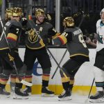 
              Vegas Golden Knights right wing Reilly Smith, center, celebrates after scoring against the San Jose Sharks during the second period of an NHL hockey game Tuesday, March 1, 2022, in Las Vegas. (AP Photo/John Locher)
            