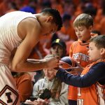 
              Illinois' RJ Melendez gives autographs to fans before an NCAA college basketball game against Iowa, Sunday, March 6, 2022, in Champaign, Ill. (AP Photo/Michael Allio)
            