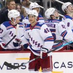 
              New York Rangers' Braden Schneider (45) returns the the bench after scoring during the second period of an NHL hockey game against the Pittsburgh Penguins in Pittsburgh, Tuesday, March 29, 2022. (AP Photo/Gene J. Puskar)
            