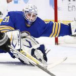 
              Buffalo Sabres goaltender Dustin Tokarski (31) reaches out to make a save during the second period of an NHL hockey game against the Los Angeles Kings, Sunday, March 6, 2022, in Buffalo, N.Y. (AP Photo/Jeffrey T. Barnes)
            