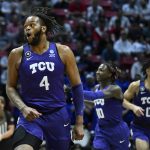 
              TCU center Eddie Lampkin (4) reacts with teammates during the first half of a first-round NCAA college basketball tournament game against Seton Hall, Friday, March 18, 2022, in San Diego. (AP Photo/Denis Poroy)
            
