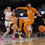 
              Tennessee's Alexus Dye (2) and Louisville's Emily Engstler (21) reach for a loose ball during the first half of a college basketball game in the Sweet 16 round of the NCAA women's tournament Saturday, March 26, 2022, in Wichita, Kan. (AP Photo/Jeff Roberson)
            