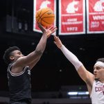 
              Santa Clara guard PJ Pipes (2) shoots over Washington State guard Tyrell Roberts (2) during the second half of an NCAA college basketball game in the NIT on Tuesday, March 15, 2022, in Pullman, Wash. (Zach Wilkinson/Lewiston Tribune via AP)
            