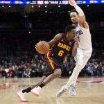 
              Atlanta Hawks guard Lou Williams (6) drives to the basket past Los Angeles Clippers guard Amir Coffey (7) during the second half of an NBA basketball game Friday, March 11, 2022, in Atlanta. (AP Photo/Hakim Wright Sr.)
            