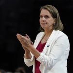 
              South Dakota head coach Dawn Plitzuweit is seen on the sidelines during the first half of a college basketball game against Michigan in the Sweet 16 round of the NCAA women's tournament Saturday, March 26, 2022, in Wichita, Kan. (AP Photo/Jeff Roberson)
            