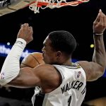 
              San Antonio Spurs guard Lonnie Walker IV (1) scores against the Oklahoma City Thunder during the second half of an NBA basketball game, Wednesday, March 16, 2022, in San Antonio. (AP Photo/Eric Gay)
            
