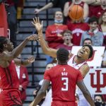
              Indiana center Michael Durr loses control of the ball while being defended by Rutgers center Clifford Omoruyi (11), left, and forward Mawot Mag (3) during the first half of an NCAA college basketball game, Wednesday, March 2, 2022, in Bloomington, Ind. (AP Photo/Doug McSchooler)
            