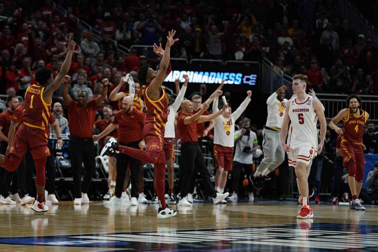 Iowa State players react in front of Wisconsin's Tyler Wahl after a second-round NCAA college baske...